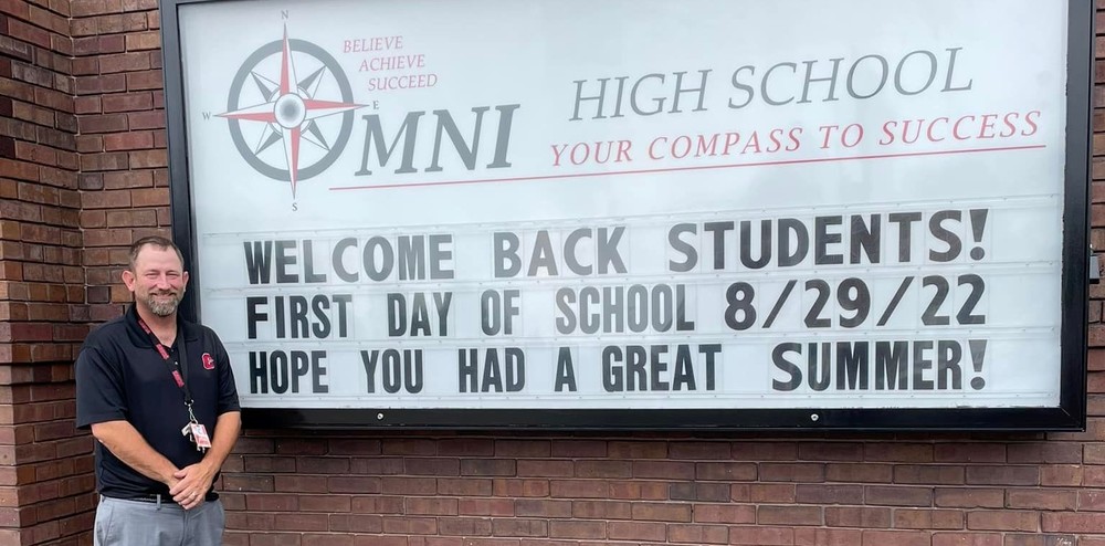 Omni principal with welcome back sign